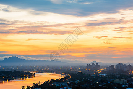 夕阳下的河畔城市景观背景图片