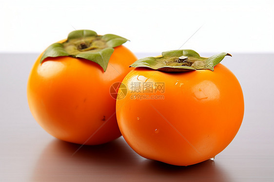 新鲜采摘的柿子图片