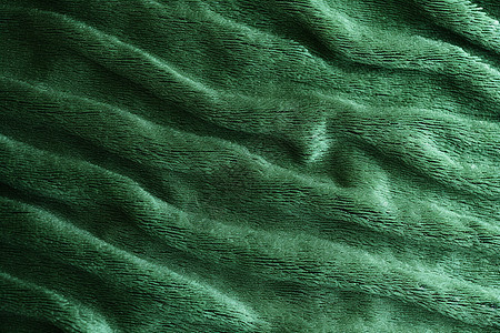 深绿色粗织物毛毯的纹理背景图片