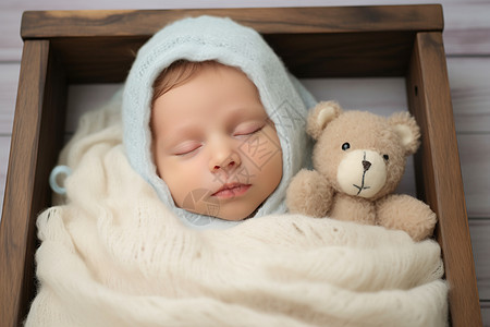 小熊玩偶旁熟睡的婴儿图片