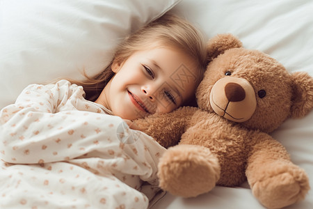 床上的小女孩和小熊图片