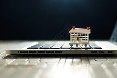键盘上的房屋模型背景图片