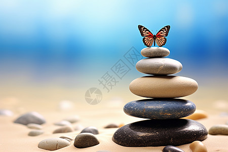 禅意鹅卵石上的蝴蝶背景图片