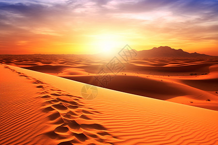 夕阳下沙漠中的脚印背景图片
