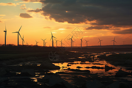夕阳下的风力发电机背景图片