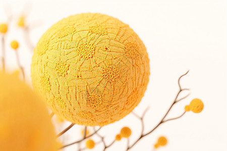 温暖的黄色针织刺绣花朵背景图片