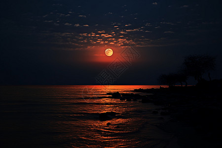 夜晚海边的红月图片
