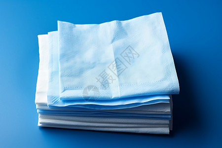 柔软的白色餐巾纸背景图片