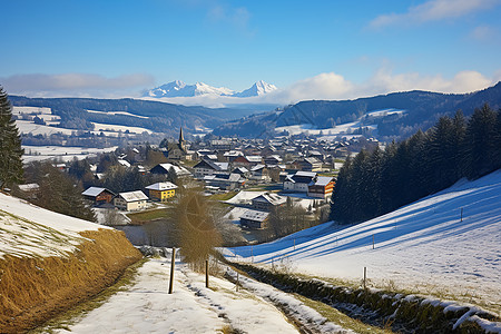 雪山村庄和路边几棵树背景图片