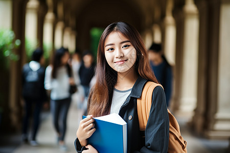 户外拿着书本的学生背景图片