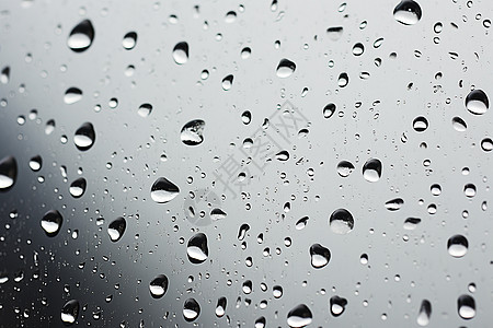 雨中微观水珠沾湿的窗户玻璃图片