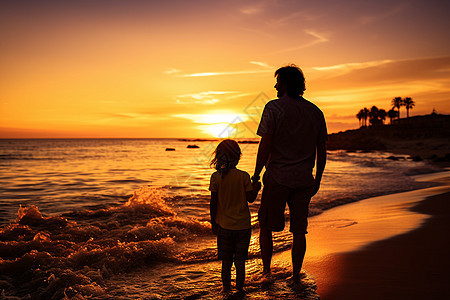 夕阳余晖下沙滩散步的父女背景图片