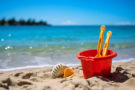 沙滩上的玩具桶图片