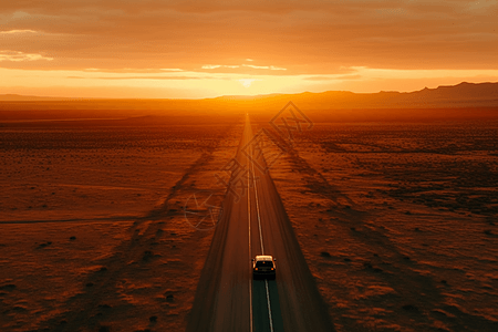 空旷沙漠中行驶的汽车背景图片