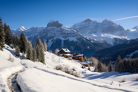 冬日白雪覆盖的山顶小屋背景图片