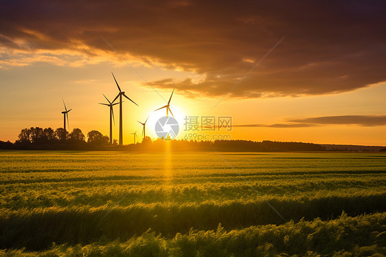 绿草地上的风力发电机图片