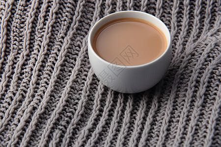 毛衣上温暖的咖啡图片