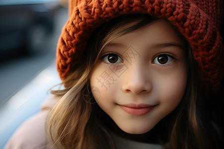 小女孩戴着红色针织帽图片