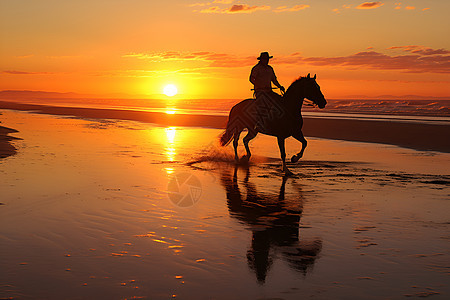 黄昏下沙滩骑马的人背景图片
