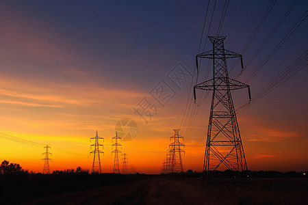 日落下的电力高压塔图片