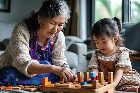 一起趣玩祖母与小女孩一起玩积木背景