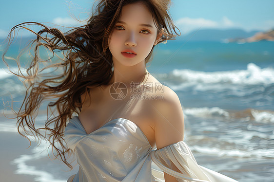 沙滩上的白裙少女图片