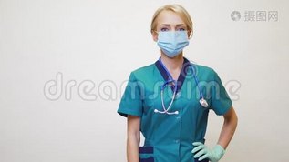 医生护士戴着防护面具和乳胶手套的妇女-在空白复印处展示mov格式视频下载_正版视频编号1116730-摄图网