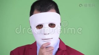 戴着白色面具的亚洲商人戏剧性mov格式视频下载_正版视频编号1870723-摄图网