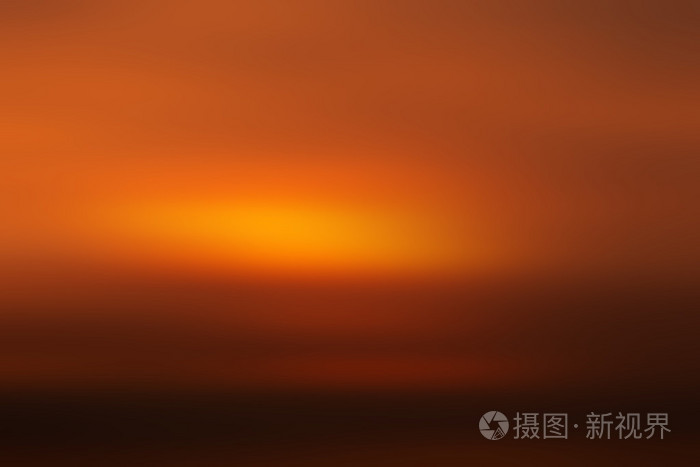模糊的梯度橙色和暗色调的背景