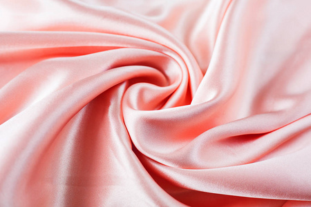 光滑的优雅粉红色丝绸或缎子纹理可以用作婚礼 bac