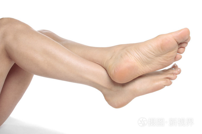 女人的腿和脚被隔离在白色上照片-正版商用图片014deb-摄图新视界