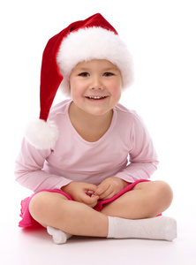 戴着红色圣诞帽的小女孩
