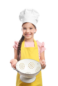 可爱的女孩在厨师帽子与漏勺图片