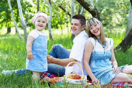 Young family of three on a picnic