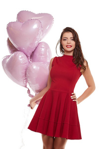 美丽时髦的女人在红色的粉红色气球造型