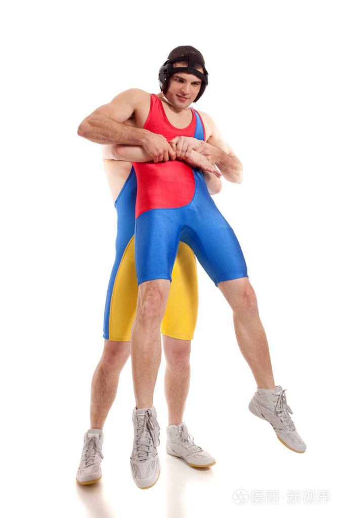 两个男子摔跤运动员。射过白色的工作室