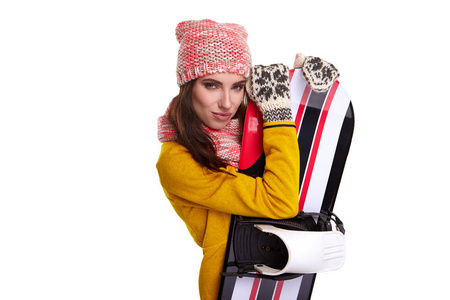 女人穿着冬衣在工作室举行滑雪