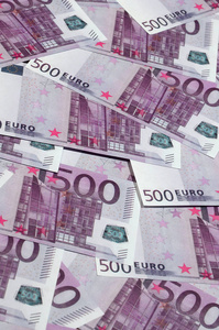 关闭背景照片金额500纸币的欧洲联盟货币。许多粉红色的500欧元纸币是相邻的。财富象征纹理照片