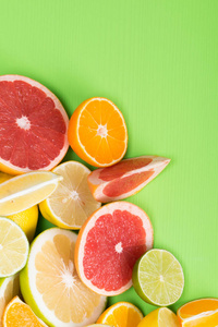 柑橘的绿色背景与维生素 C 和各种水果橙, greyfruit 和柠檬