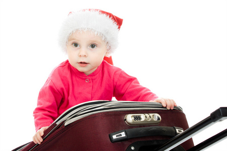 白色背景手提箱里的圣诞婴儿。