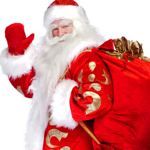 圣诞老人站起来与他的完整的包在白色背景上