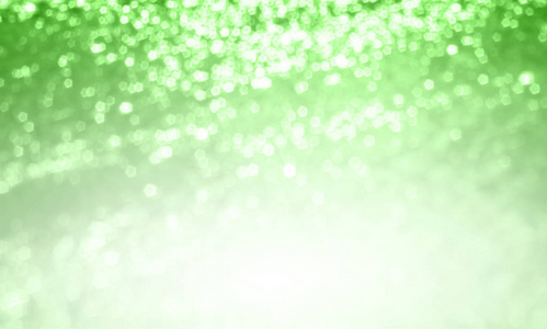 抽象灯绿色模糊闪烁背景。软焦点