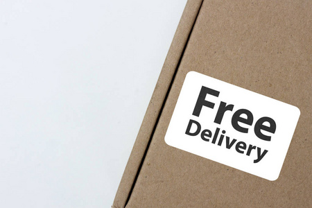 免费送货, 商务, 网上购物, 电子商务和送货服务概念棕色框与注释 免费送货 在灰色背景下