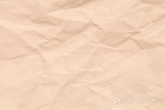 纸米色的颜色老化和皱纹.褐色颜色的背景与瑕疵和磨损