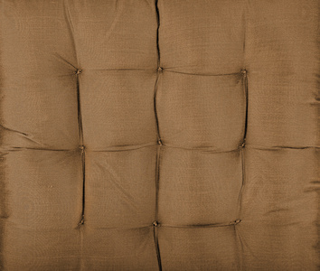 棕色织物纹理的旧沙发上图片