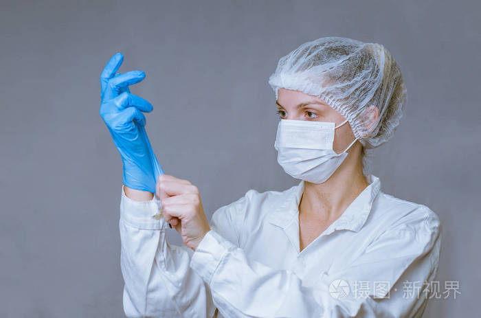 医学的伟大概念年轻护士戴上手套