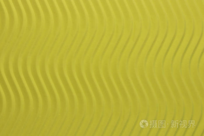 黄色纸垂直波浪纹理在详细的纸张背景上浮雕波浪波纹波浪纸板背景