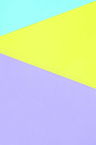 纹理背景的时尚粉彩色彩。紫罗兰色黄色和蓝色几何图案纸。最小抽象