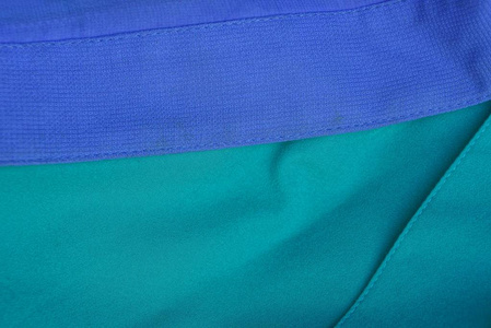 蓝色绿色纹理织物的皱巴巴的物质片断