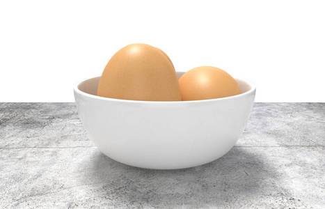 呈现白色陶瓷碗鸡蛋。放在混凝土桌上